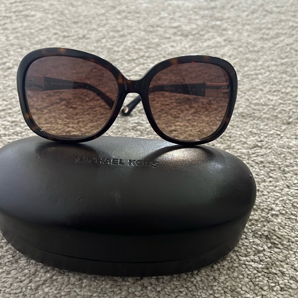 Michael Kors sunglassses with gold sparkle along the side